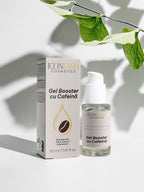 Gel Booster cu Cofeină IconLash, flaconul și cutia pe un fundal luminos, sub frunze verzi